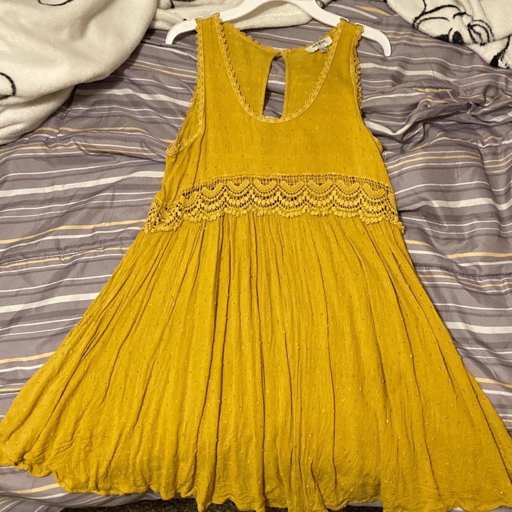 A size small in juniors section, never worn, brand Umgee, it’s a yellow dress